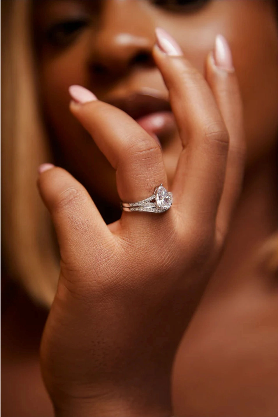 Split Shank Pear Cut Moissanite Centre and Diamond Side Stones Bride Set in 18K Gold